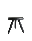 Black Meribel Stool made of imported teak wood inspired by the architectural style of the Alps, featuring manual polishing and charcoal finish.