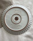 Marumitsu Barbarie plate base, featuring pottery material details and French text on a textured surface.