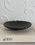 Yukiwa Plate by Yoshida Pottery, elegantly designed with nature-inspired patterns, displayed on a textured background.