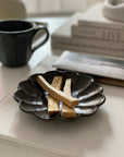 Elegant Rinka plate 14cm with wooden incense sticks, showcasing Japanese craftsmanship. Perfect for enhancing table aesthetics.