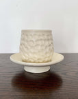 Elegant Shinogi Cup and Saucer Set by Masakazu Yoshida with nature-inspired design on dark wood table from Yoshida Pottery Collection.