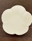 Elegant UME bowl from Yoshida Pottery, featuring nature-inspired patterns, crafted by ceramist Masakazu Yoshida, on a wooden table.