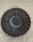 Rinka Plate by Yoshida Pottery with nature-inspired design on table setting.