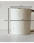 Rila Black Straight Mug dimensions displayed, highlighting a 7cm diameter, 9cm width, and 8.5cm height, with textured porcelain design.